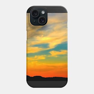 Serene sunset scenery with clement warm clouds standing out from the blue sky Phone Case