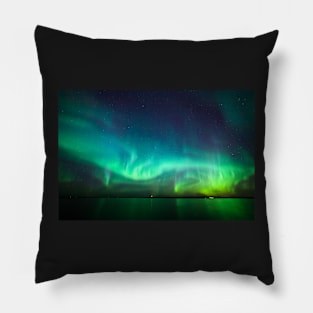 Northern lights glow over lake Pillow