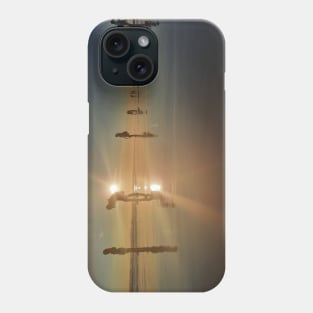 Silhouetted people in a row on a sand beach. Phone Case