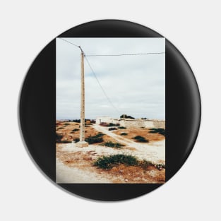 Bird Sitting on Telephone Pole in Dry North African Countryside Pin