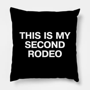 "THIS IS MY SECOND RODEO" in plain white all caps letters - cos you're not the noob, but barely Pillow