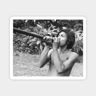 young man using blowgun Magnet