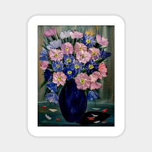 A lovely boutique of flowers in a blue vase . Magnet