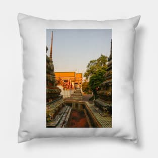 Third sidewalk view to ornate roof, flanked from parts of Chedis at Wat Pho. Pillow