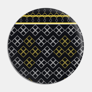 The black background fabric pattern is contrasted with white and yellow. Pin