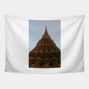 First low angle view of a Buddha stupa reaching symmetrical in the clear sky. Tapestry