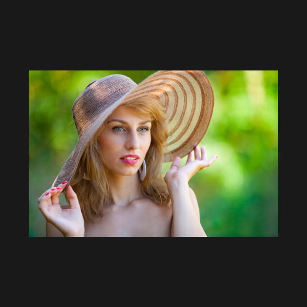 Beautiful blonde with hat outdoors by naturalis