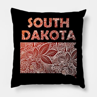 Colorful mandala art map of South Dakota with text in brown and orange Pillow