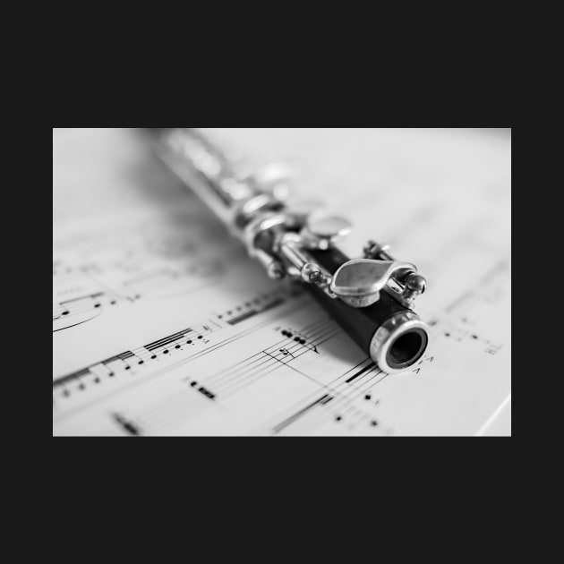 Wooden flute on sheet music by yackers1