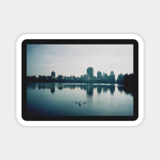 Film photo of Central Park, New York City, with its lake and surrounded buildings Magnet