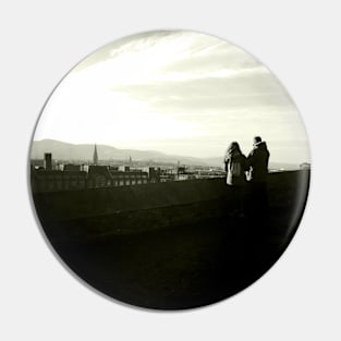 A couple take in the view near Edinburgh Castle Pin