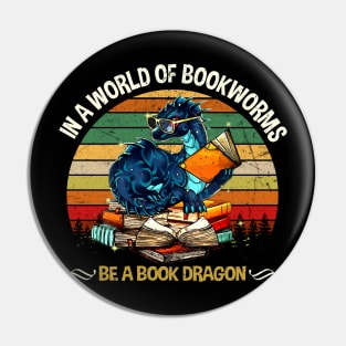 IN A WORLD OF BOOKWORMS BE A BOOK DRAGON Pin