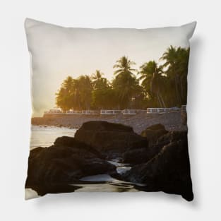 rocky beach and cliff with palm trees Pillow