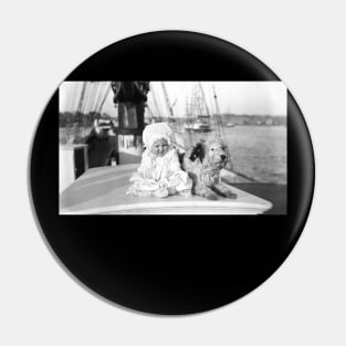 Baby and dog on large boat Pin