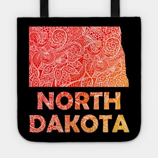 Colorful mandala art map of North Dakota with text in red and orange Tote