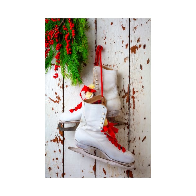 Ice Skates Hanging On White Wall by photogarry