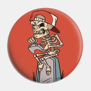 Cartoon Skeleton Gamer Sitting on a Tombstone Pin