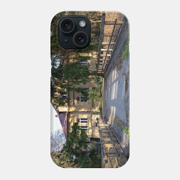 Yellow building in a park behind a bridge Phone Case by KargacinArt