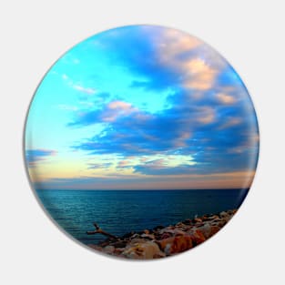 Sunset sky over the rocky beach and the sea Pin