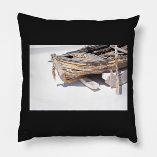 Old wooden dinghy. Pillow