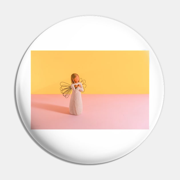 Angel on a Yellow and Pink Background Pin by Design A Studios