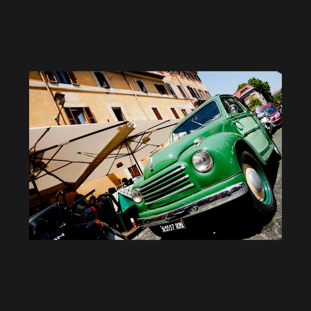 Green classic Fiat truck parked in Italian Street. by brians101