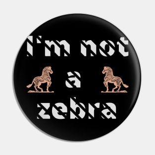 I'm not a zebra. White letters with a mask in the shape of diagonal stripes and two red zebras Pin