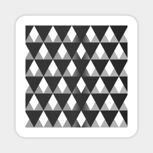 Black and grey triangular pattern background filling the frame. Magnet