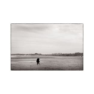 A couple embrace on the beach at Alnmouth, Northumberland, UK T-Shirt