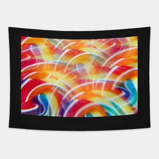 Close-up of swirly rainbow lollipop through prism filter Tapestry