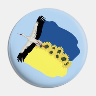 A Stork carries a Ukrainian flag and sunflowers on its wings Pin