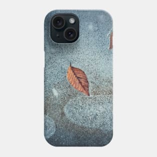 fallen leaves frozen in a puddle Phone Case