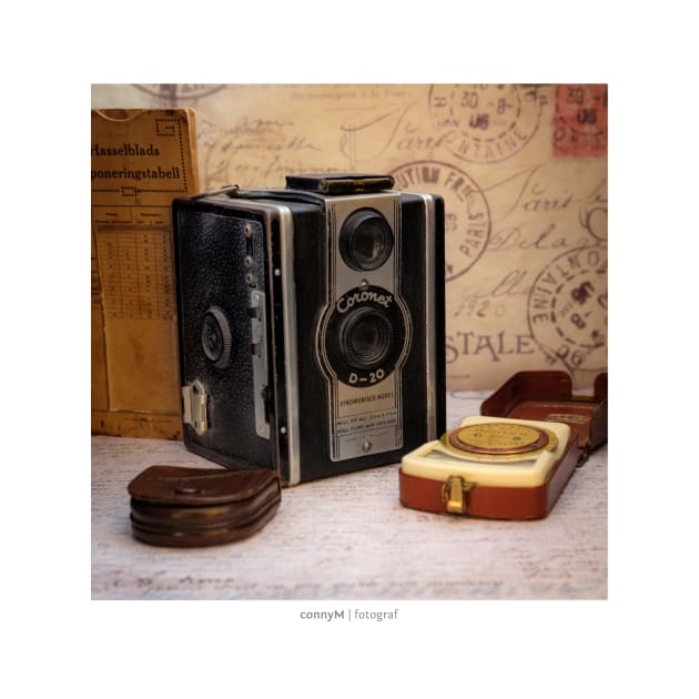 An old vintage camera with external exposure meter, as a poster by connyM-Sweden