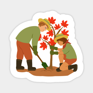 Young couple planting red maple tree. Outdoors gardening concept. Magnet