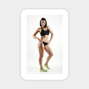 Young female fitness model on white Magnet