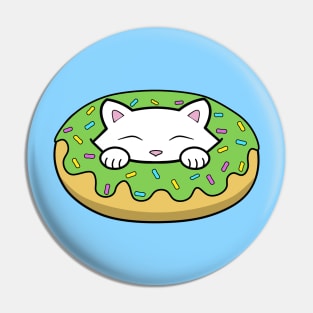 Cute kitten eating a green doughnut with sprinkles on top of it on St. Patrick's day Pin