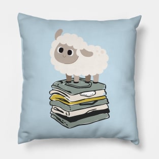 Cute Baby Sheep on top of folded clothes Pillow