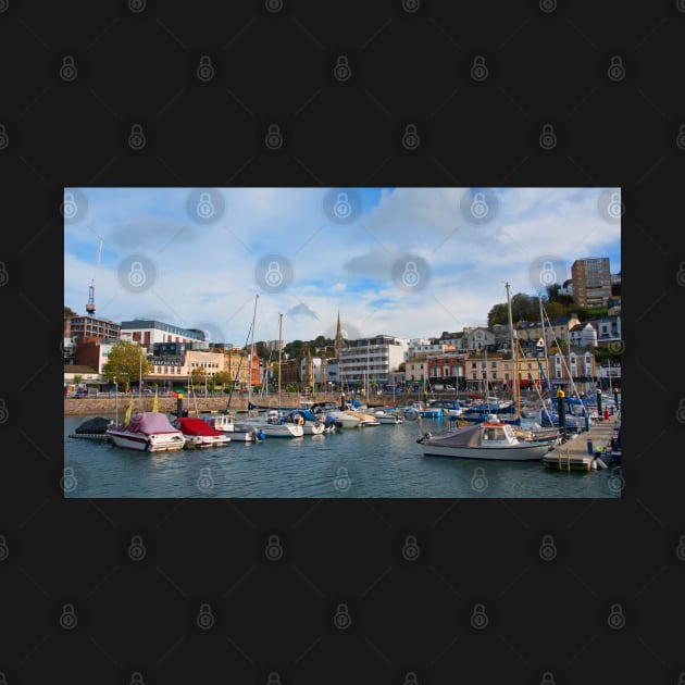 A sunny view across the boats moored in the harbour of the Devonshire seaside town of Torquay. by Graz-Photos