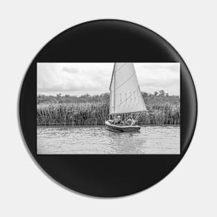 A couple sailing in the Norfolk Broads national park Pin