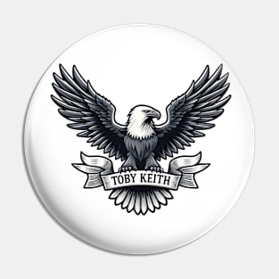 An eagle holds a sign that says Toby Keith Pin