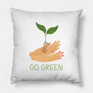 Hands holding green sprout. Pillow