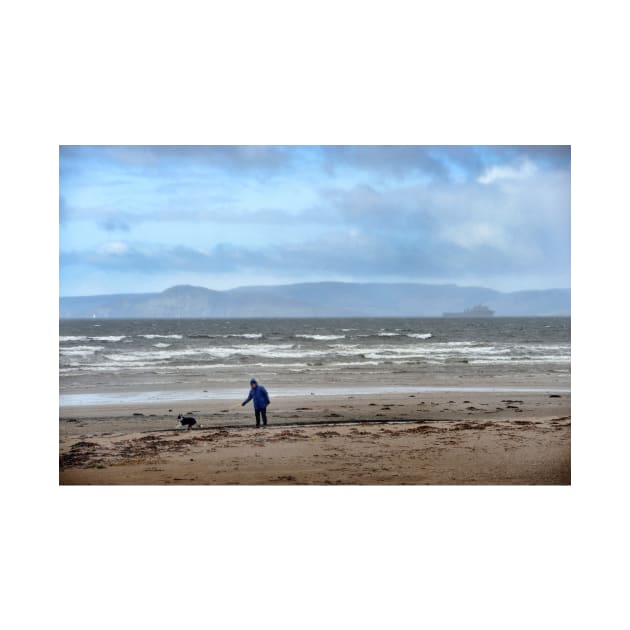 Walking the dog in blustery weather at Ardrossan, North Ayrshire, Scotland by richflintphoto