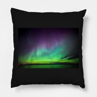 Beautiful northern lights over lake in Finland Pillow