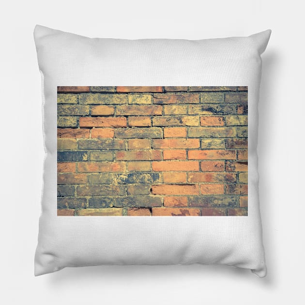 Old brick wall with cracks and scratches. Brick wall background. Distressed wall with broken bricks texture. House facade Pillow by AnaMOMarques