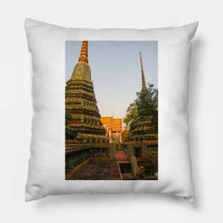 First sidewalk view to ornate roof, flanked from parts of Chedis at Wat Pho. Pillow