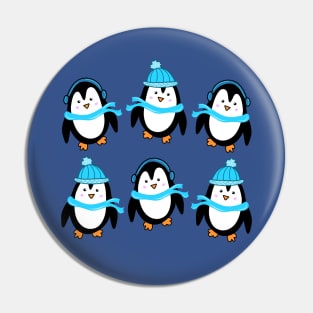 Festive Winter Penguins with Blue Scarves and Hats on a Dark Blue Backdrop, made by EndlessEmporium Pin