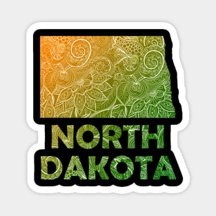 Colorful mandala art map of North Dakota with text in green and orange Magnet