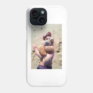 Seashells on a hand at the beach Phone Case