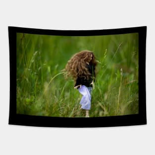 Dark haired girl walking in nature Tapestry