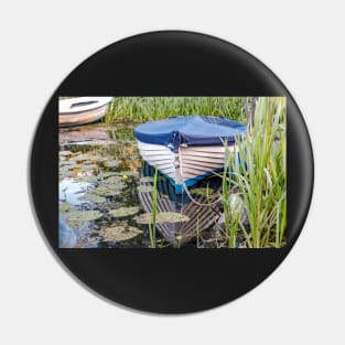 Moored row boat on the Norfolk Broads Pin